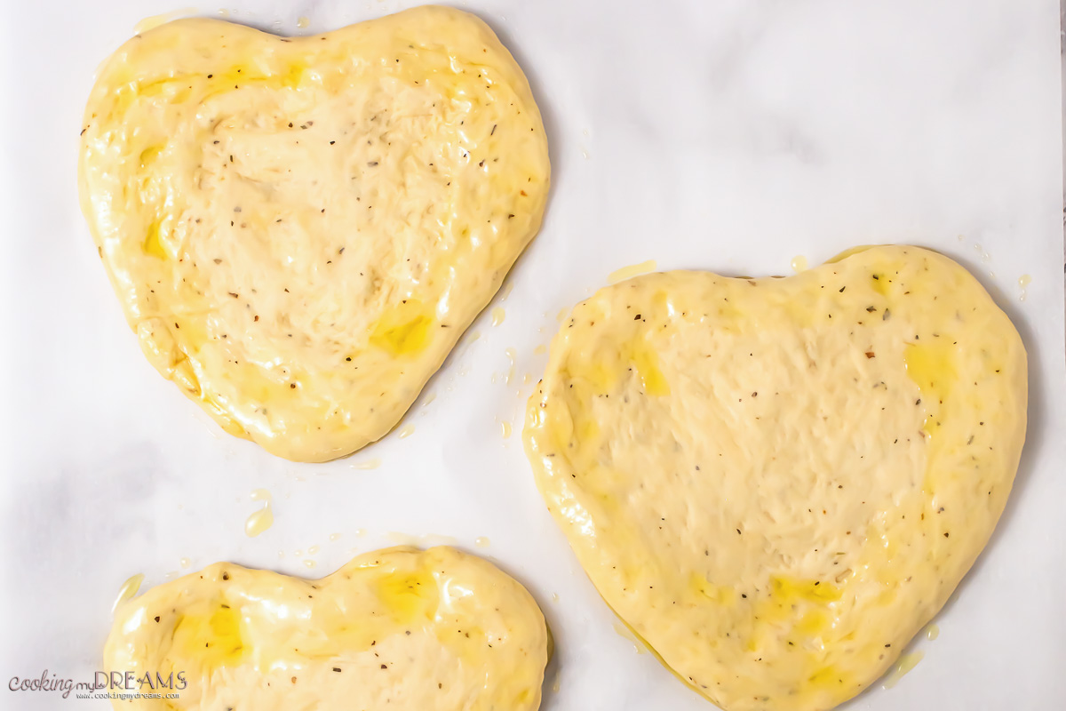 pizza dough shaped into hearts.