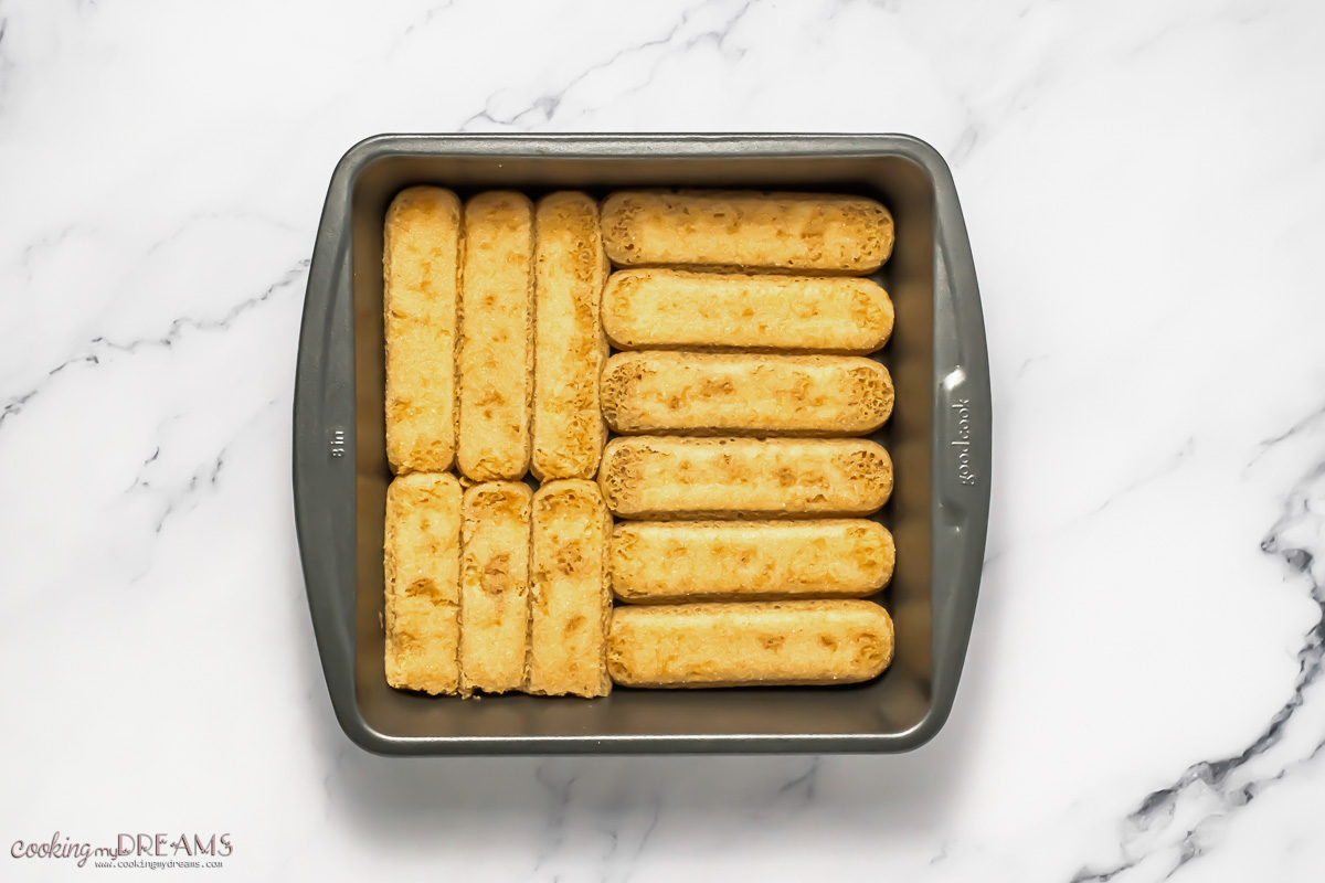 soaked ladyfingers laid in a baking pan.
