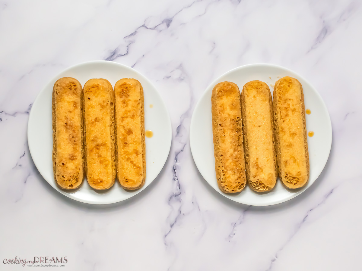 ladyfingers placed on serving plates.