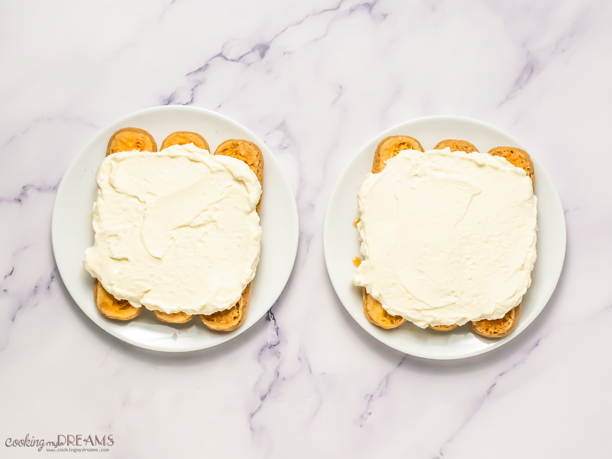 mascarpone cream topped on ladyfingers.