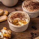 two small ramekins with single portions of tiramisu.