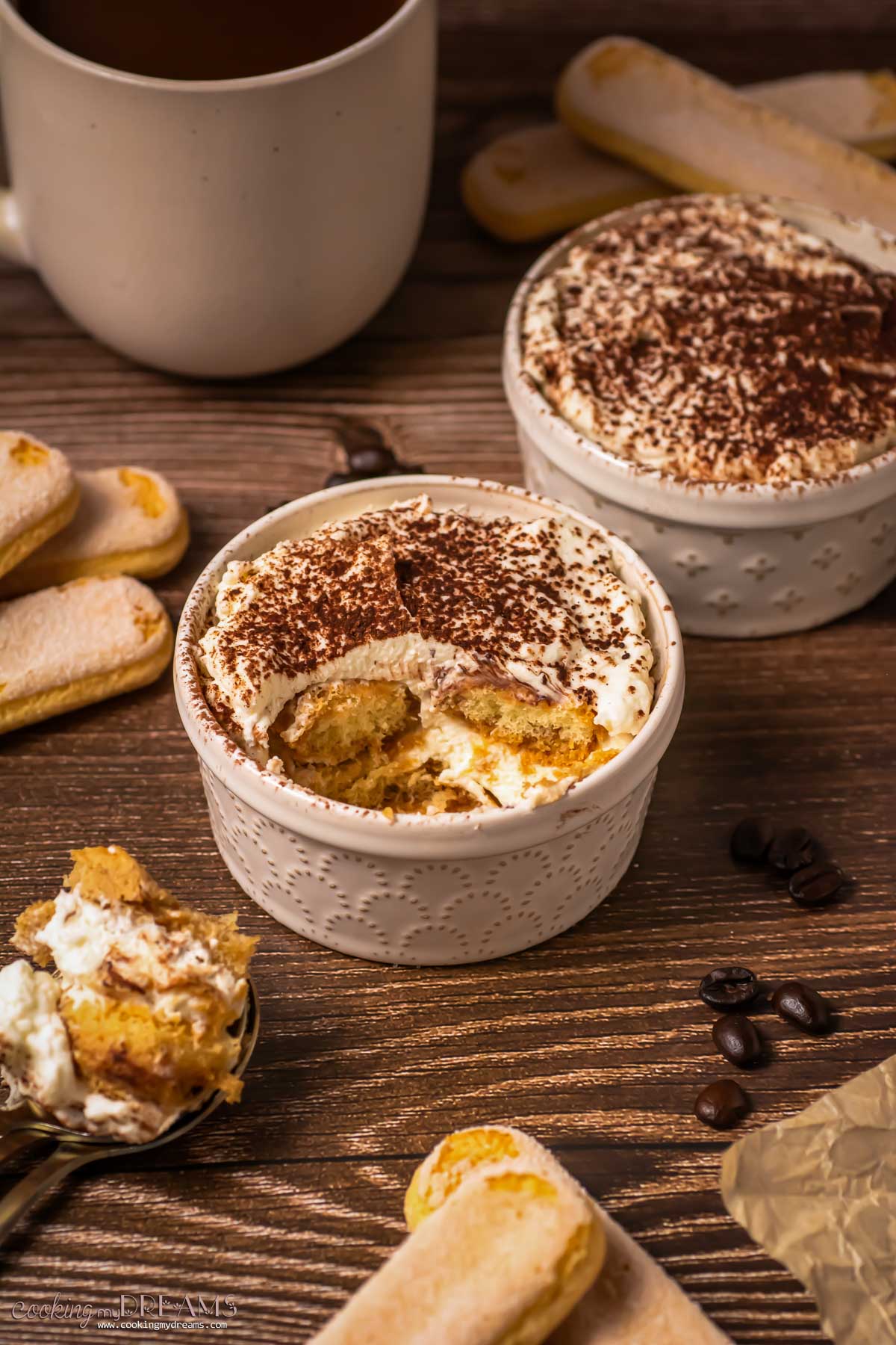 two small ramekins with single portions of tiramisu.
