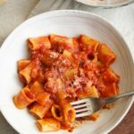 fork taking a bite of rigatoni amatriciana.