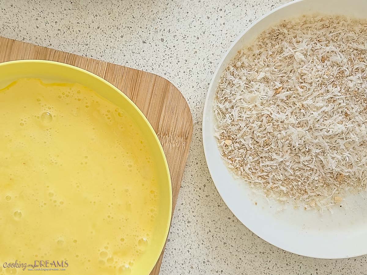 plates with beaten egg and breadcrumbs coating.