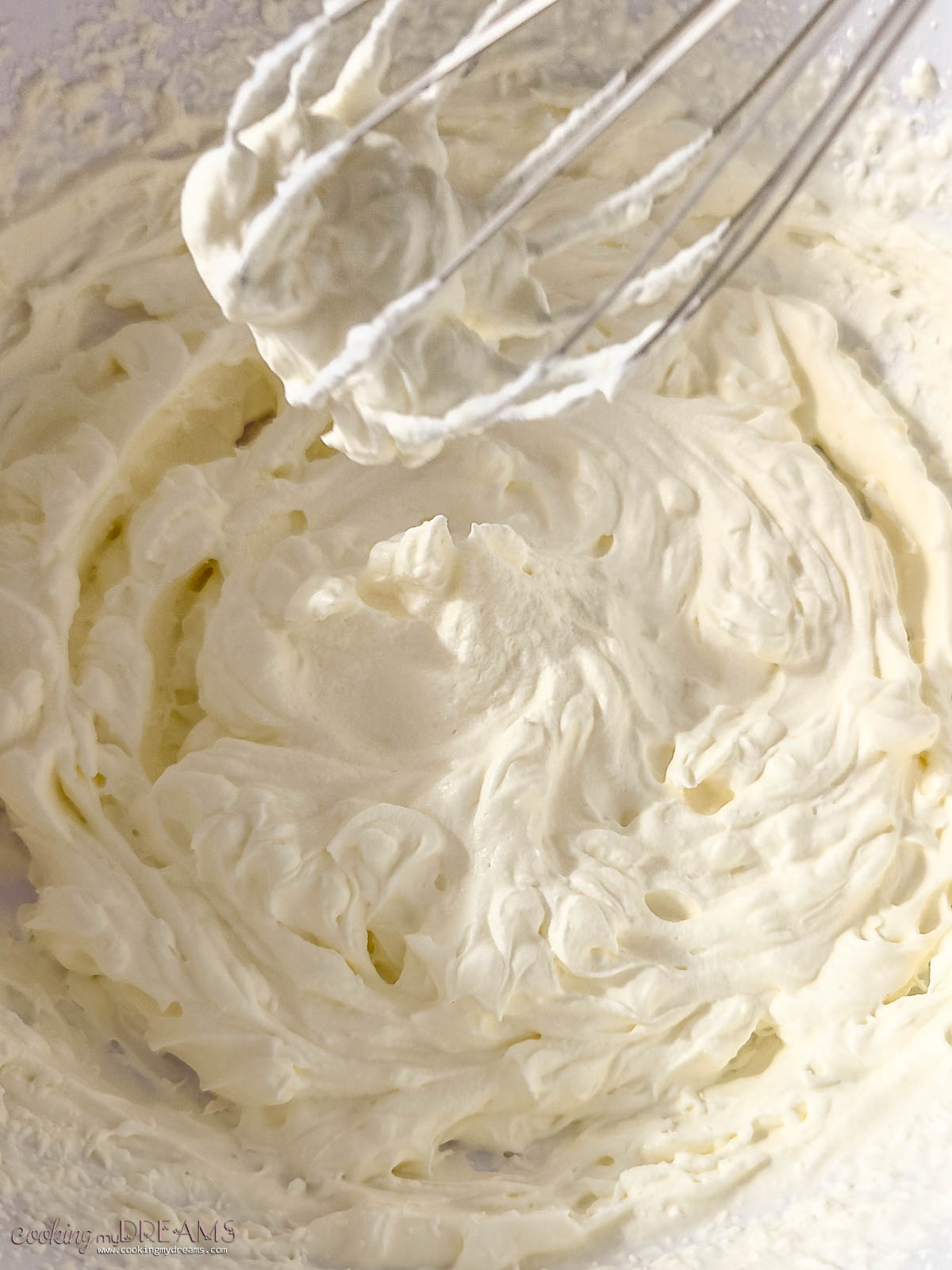 whisk whipping cream in a bowl