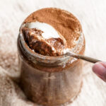 spoon lifting a bite of tiramisu overnight oats.