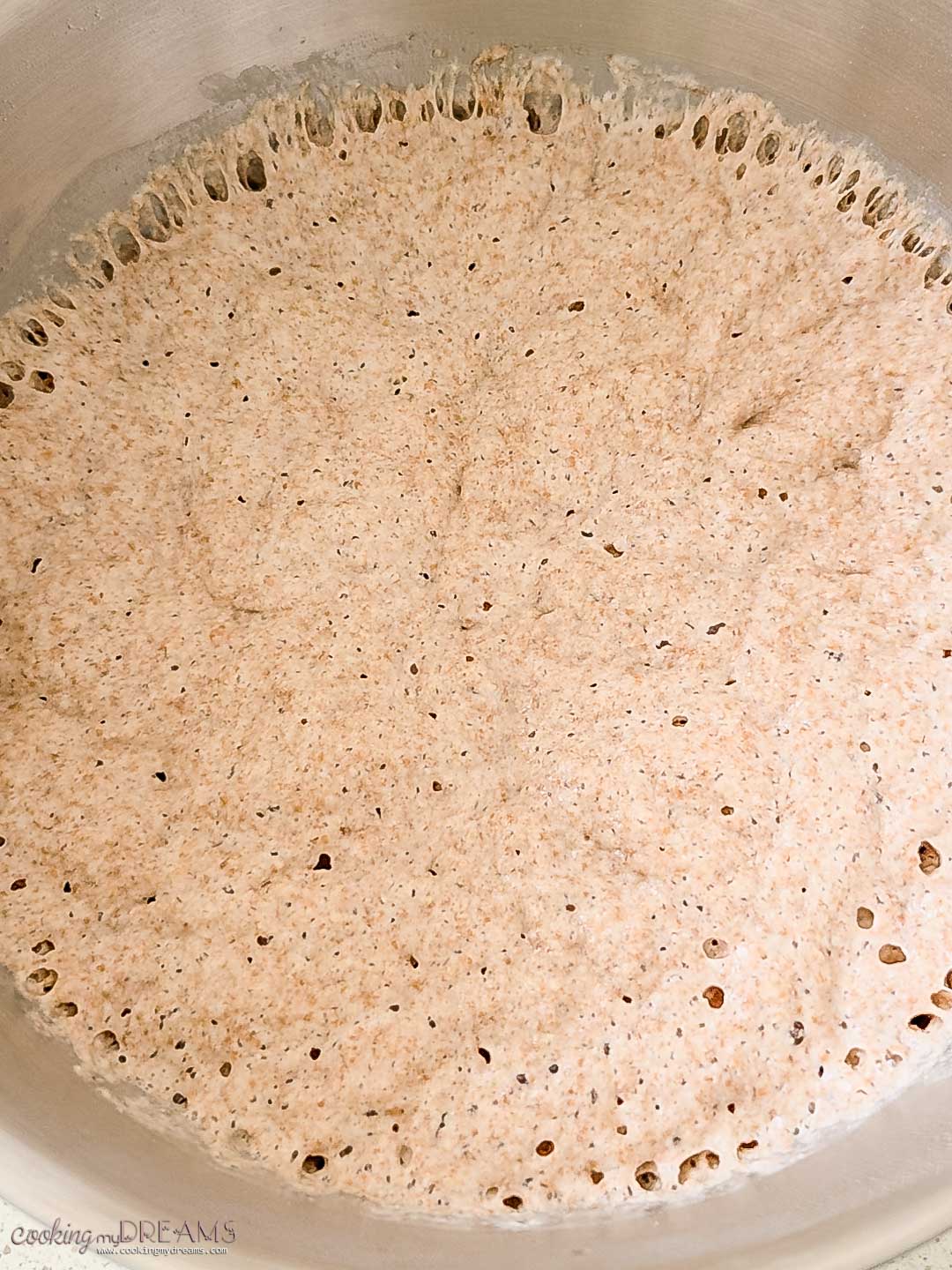 focaccia dough rising in a bowl.
